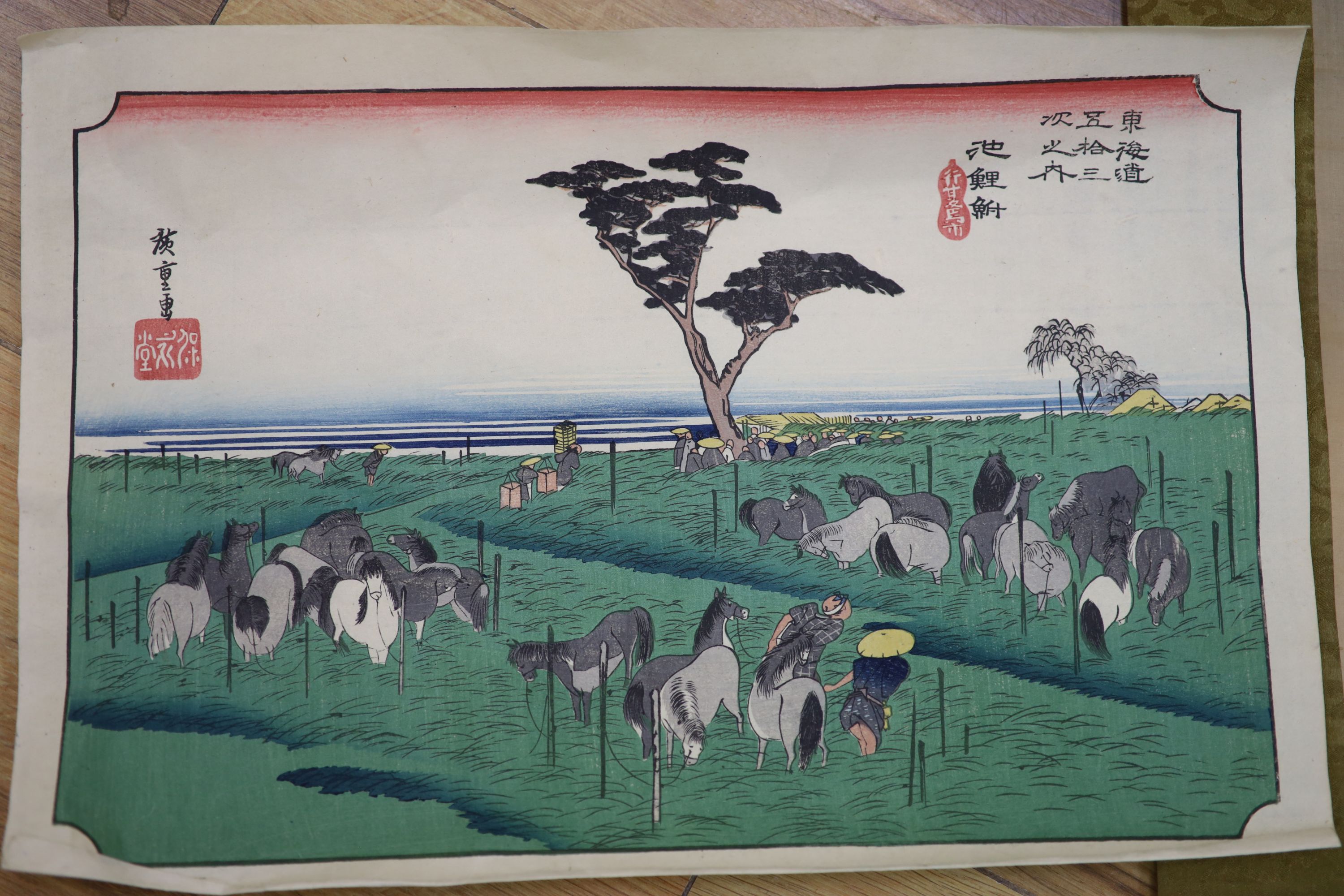 A watercolour on silk scroll painting and three unframed woodblock prints